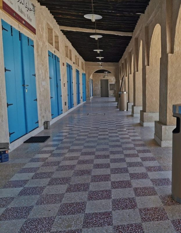 Arcaded walkway with patterned floor at the Al Khor souq