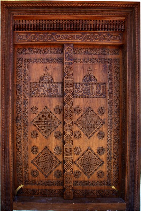 The carved timber gate of Al Wusail fort